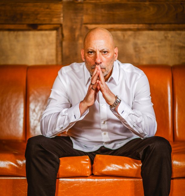 Ronnie Di Cicco seated in a direct portrait